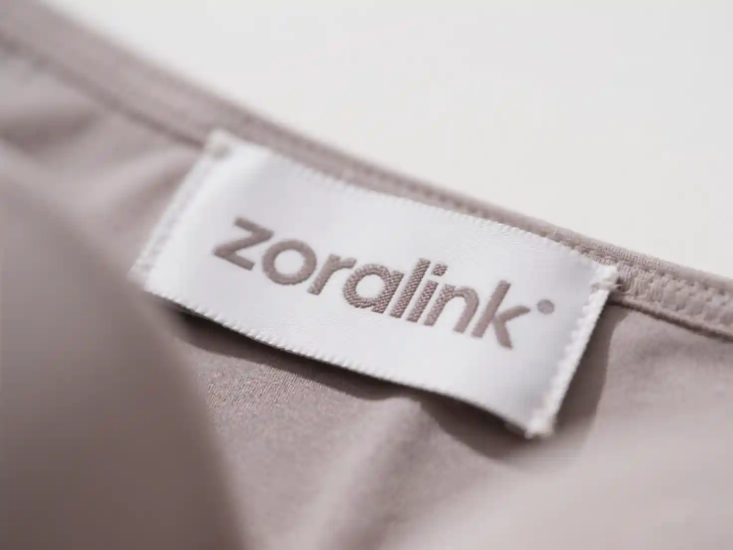 首页Quality Clothing Manufacturer With Comprehensive Services011 zoralinkcom Close up of underwear label with Zoralink logo custom lingerie branding