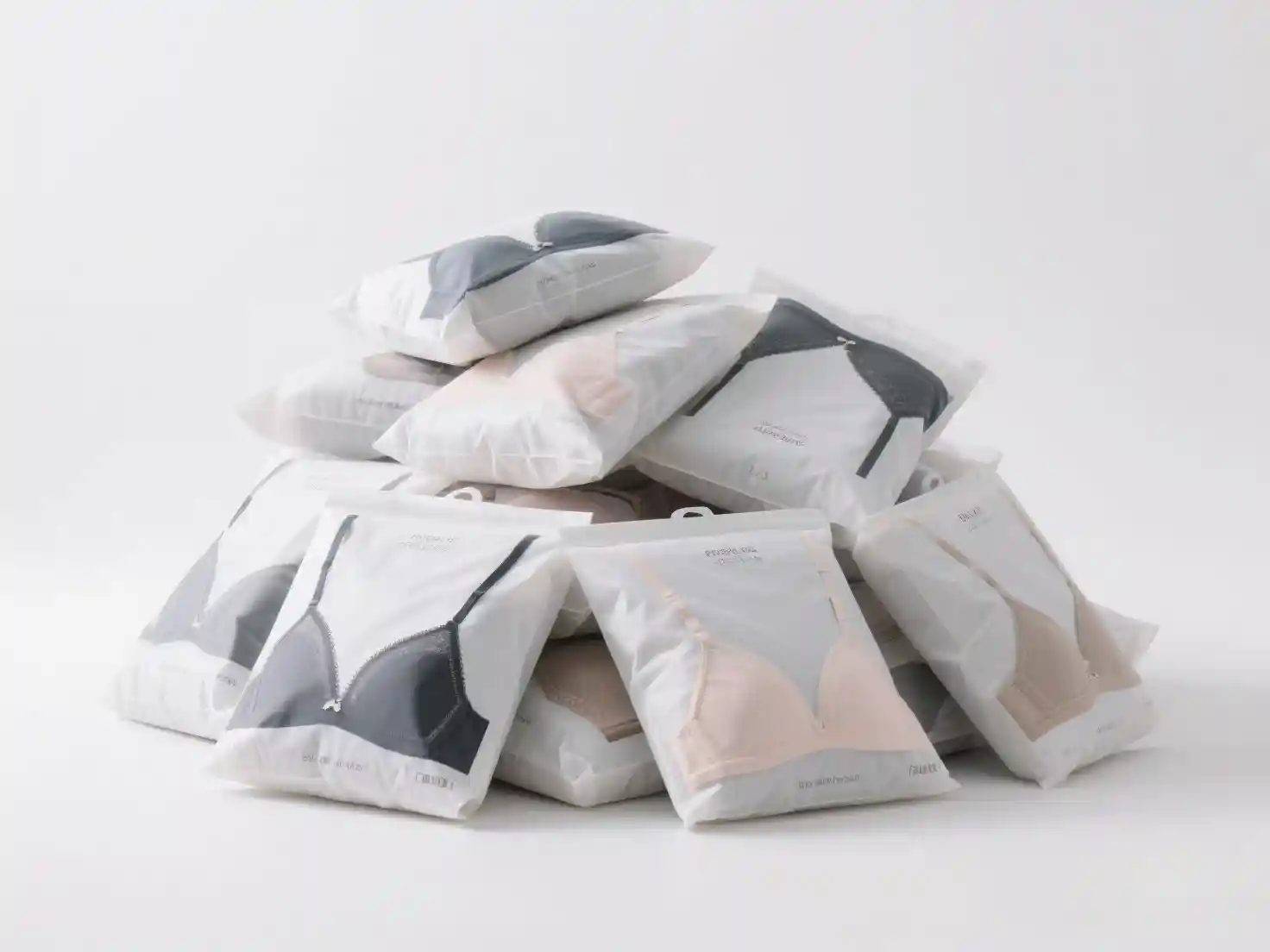 首页Quality Clothing Manufacturer With Comprehensive Services061 zoralinkcom Stack of packaged lingerie products on white floor bulk underwear supplier