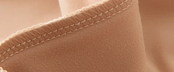Choose the Right Materials for Your Lingerie zoralinkcom Close up of womens lingerie fabric highlighting the quality stitching and material Represents the meticulous craftsmanship of lingerie manufacturers emphasizing their ability to offer custom and OEM womens lingerie with high end finishes