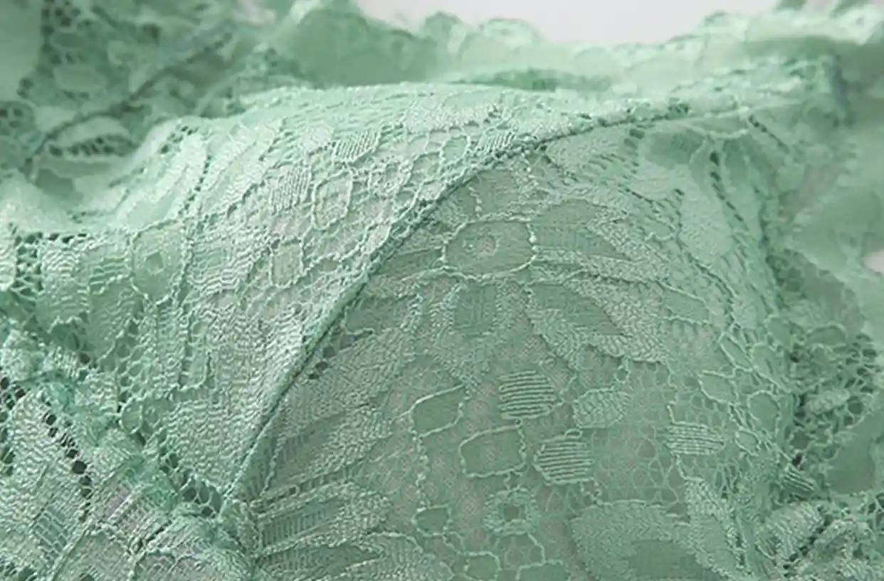 Close-up of the comfortable seamless lace fabric on a wireless bra, highlighting its delicate texture and breathability
