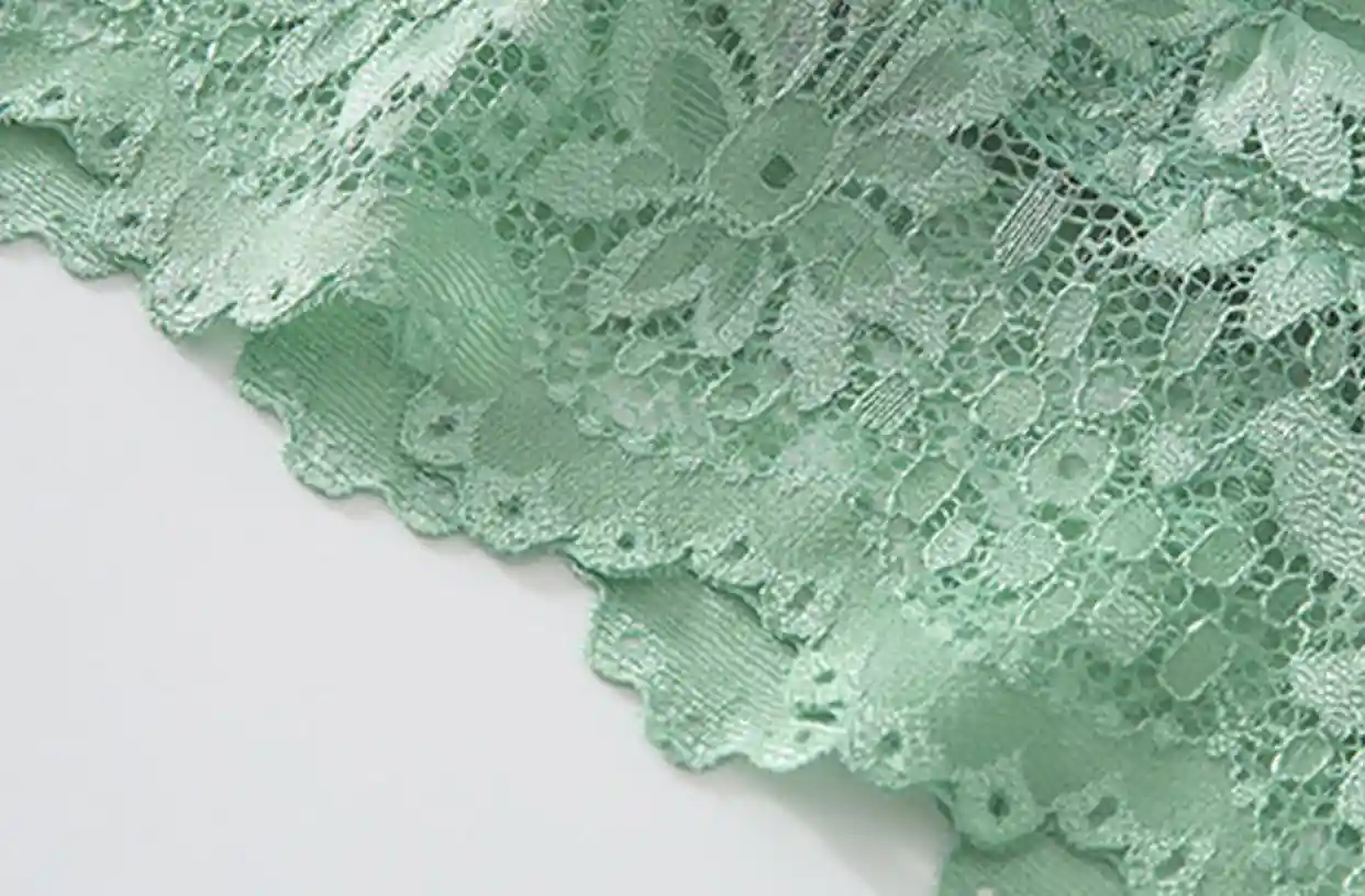 Close-up of seamless lace detailing on a wireless bra, highlighting the intricate craftsmanship and delicate design