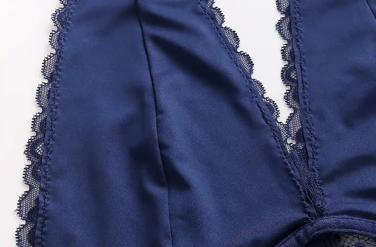Close - up of navy blue lingerie with soft fabric and seamless, delicate lace trim