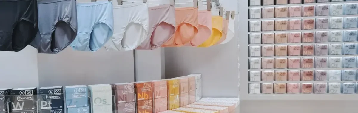 Display of various womens lingerie panties in different colors, both hanging and packaged. Represents a lingerie manufacturer offering wholesale options, emphasizing comfort and quality, with features like breathability and soft fabric, appealing to retailers and buyers seeking bulk purchases.