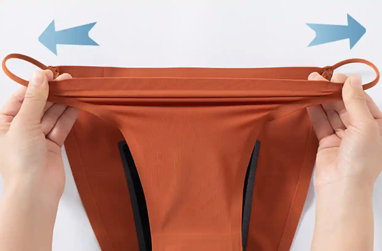Stretching ice silk underwear fabric demonstrating 40% elasticity enhancement in tension test