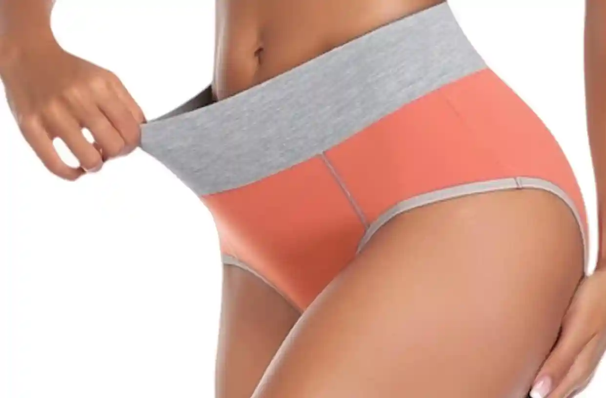 Model wearing soft cotton underwear, demonstrating its elasticity as it stretches, showcasing the comfortable and breathable fabric