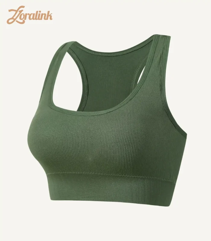 A dark green seamless sports bra with a ribbed texture and racerback design crafted from stretchy material for comfort and support during workouts