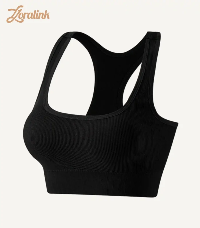 A seamless black sports bra with a ribbed texture and racerback design, made from stretchy material for comfort and support.