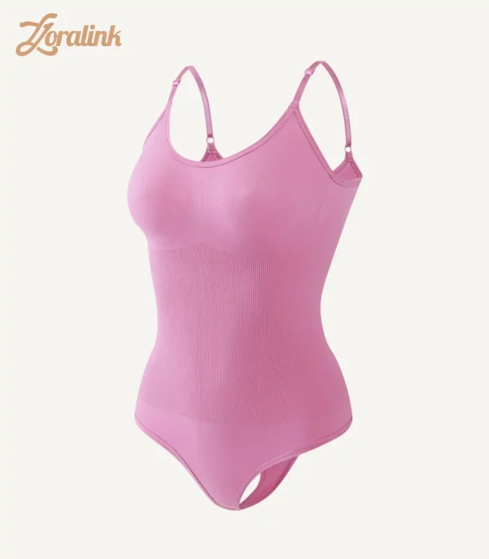 Pink seamless bodysuit as shapewear with tummy control function for body shaping featuring thin shoulder straps and waist cinching texture