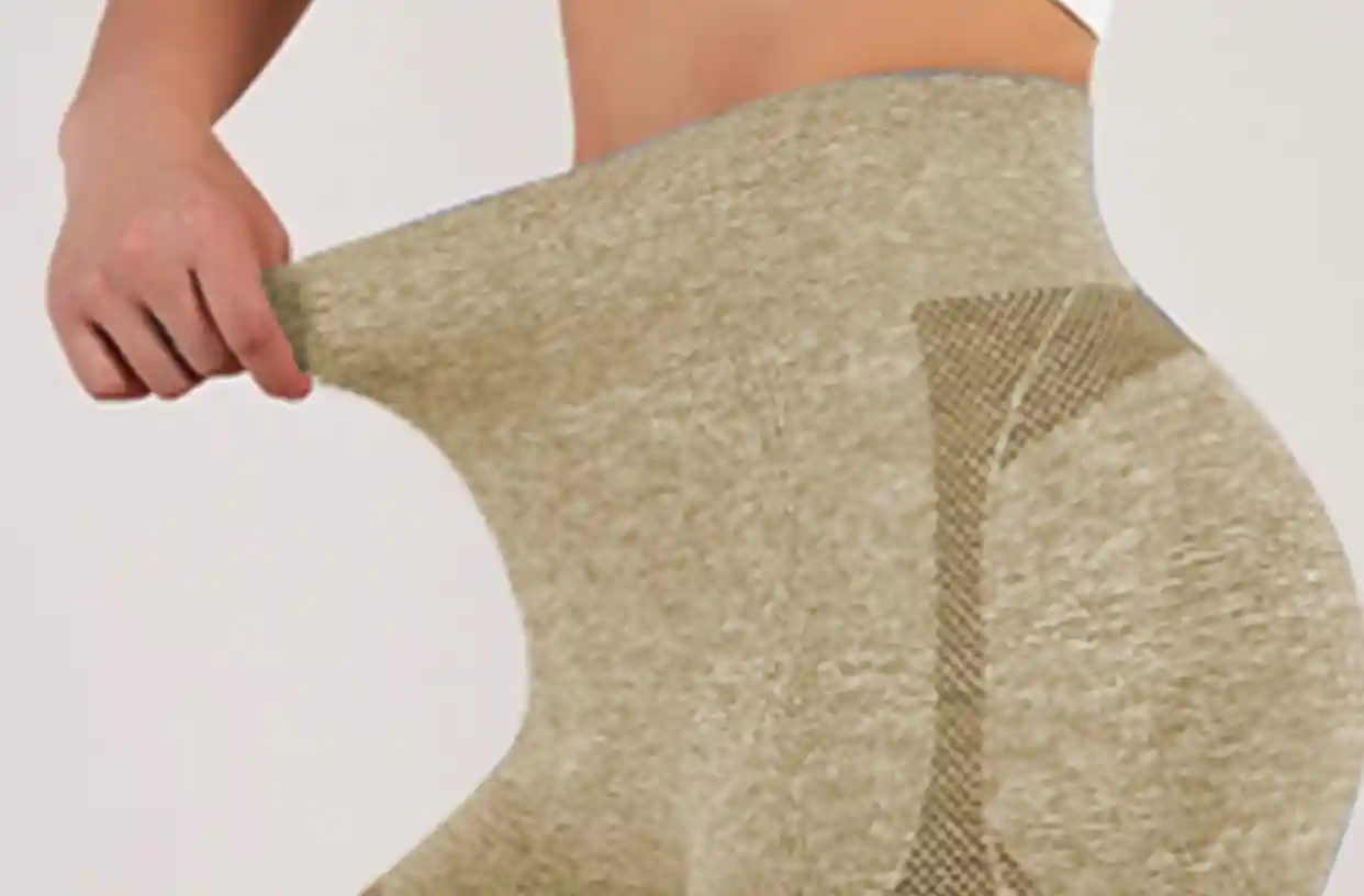 Seamless Sports Underwear HighWaist Butt Lifting Breathable11 zoralinkcom A person demonstrating the stretchability of seamless high waisted olive green sports underwear shorts with a butt lifting design