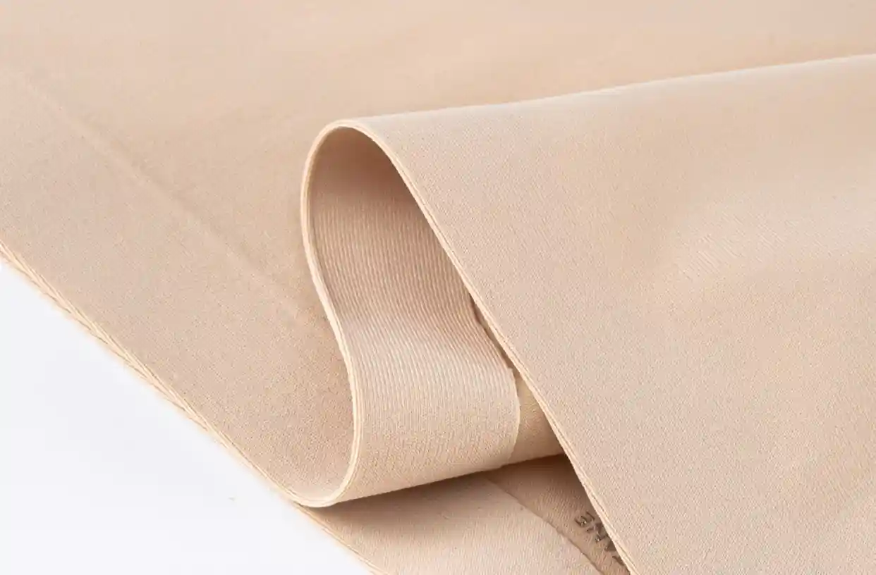 Sports Thongs Panties Seamless Soft Bonded Comfort11 zoralinkcom Close up of a beige fabric highlighting its soft texture and smooth surface likely used in the production of sports thongs panties for comfort