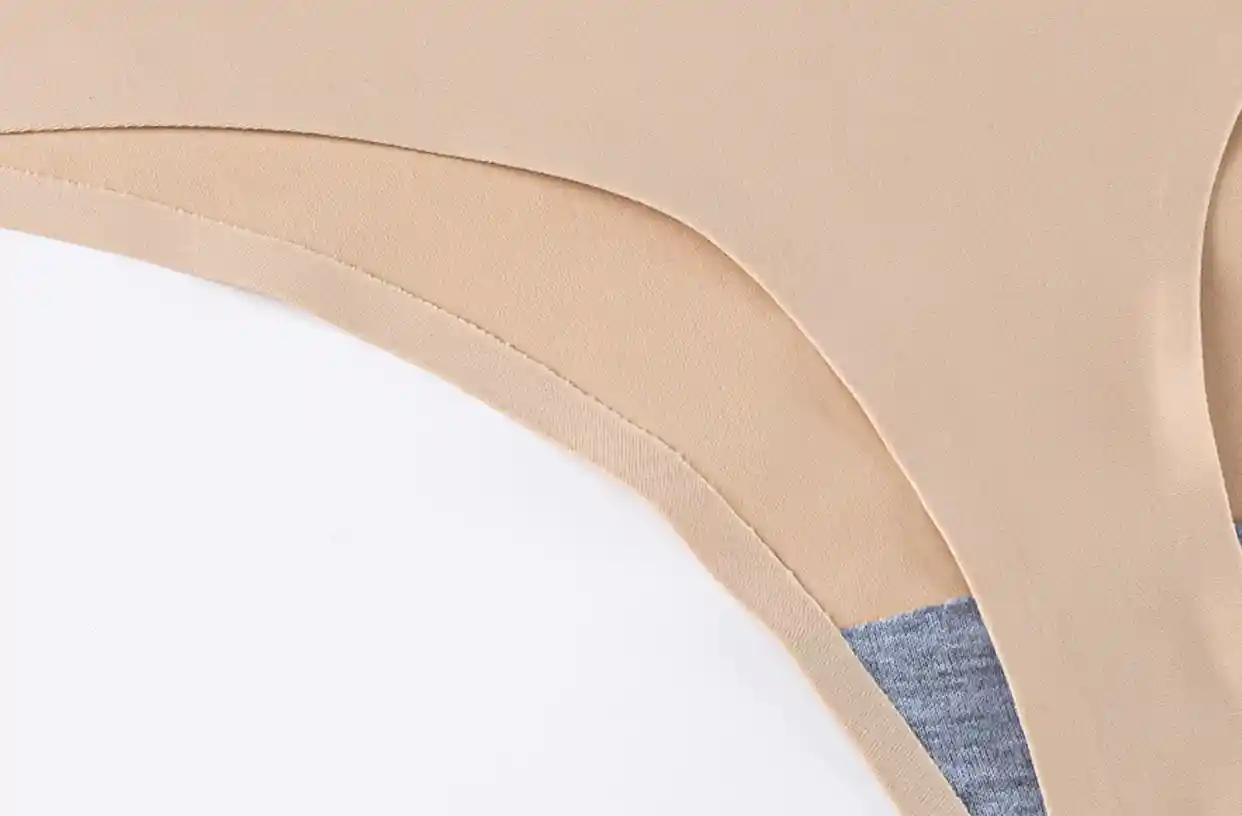Sports Thongs Panties Seamless Soft Bonded Comfort12 zoralinkcom Close up of a beige sports thongs panties highlighting the bonded seams and soft fabric for comfort and durability