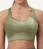 Square Collar Sports Bra09 zoralinkcom Woman in green seamless sports bra showcasing full coverage design and high elastic straps for fitness activities The breathable material ensures moisture wicking and comfort during workouts