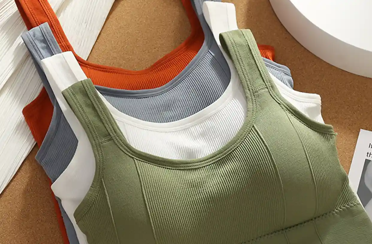 Square Collar Sports Bra14 zoralinkcom Stacked colorful seamless sports bras showcasing various designs and vibrant colors ideal for fitness and everyday wear