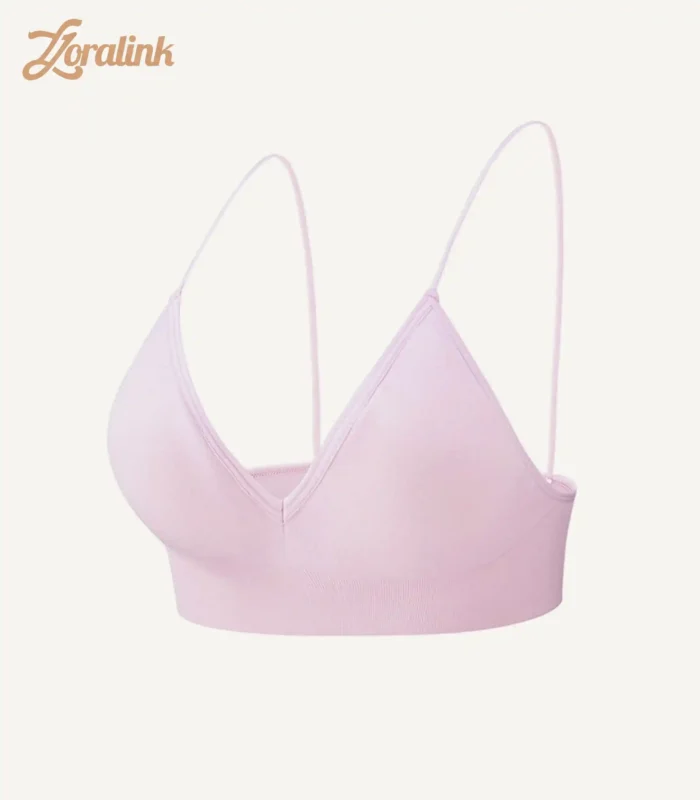A seamless wireless triangle bra in light pink offering comfort and a soft feminine look