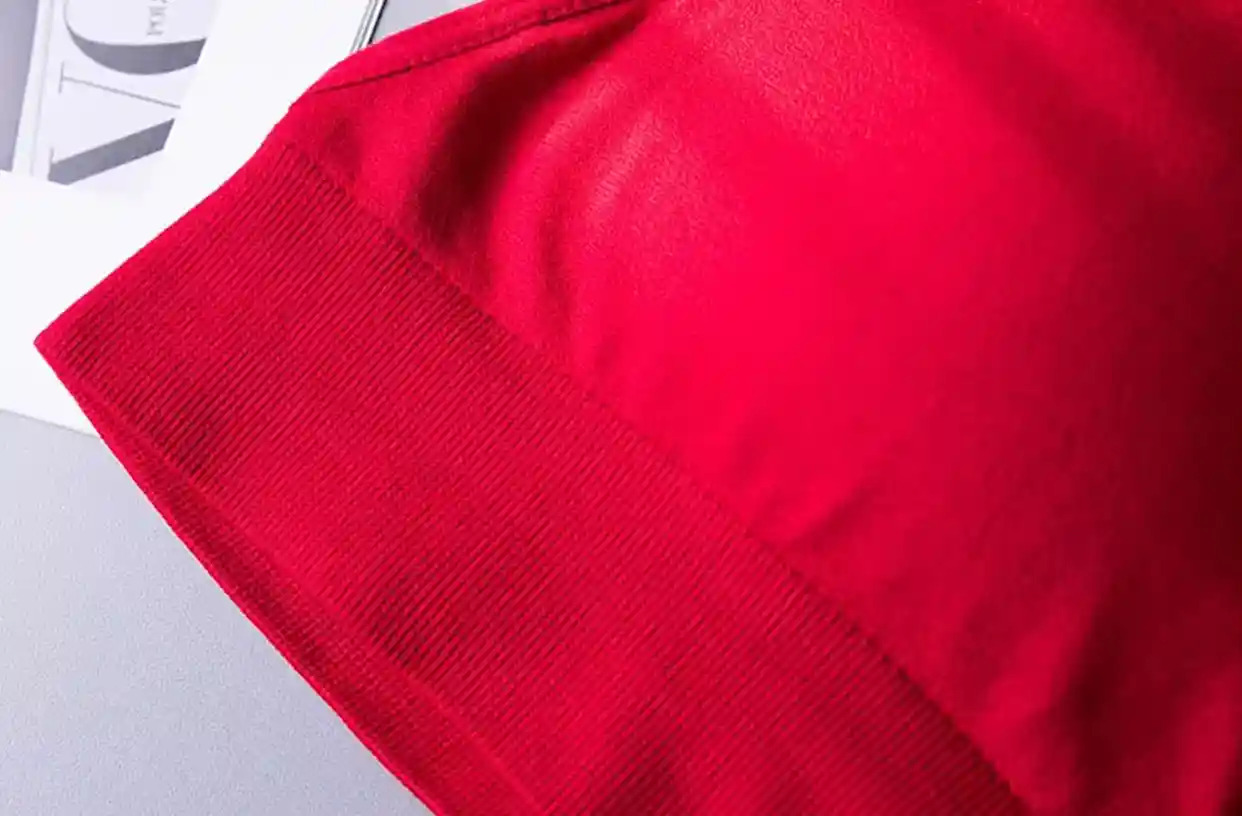 Triangle Bra Seamless Wireless Comfort Style12 zoralinkcom Close up of a red garments fabric highlighting its texture and seamless design for comfort