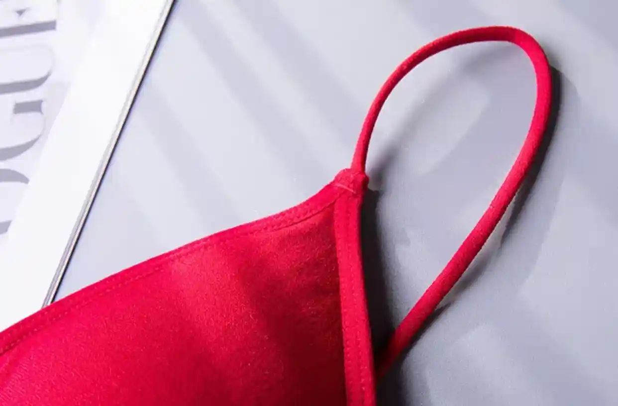Triangle Bra Seamless Wireless Comfort Style16 zoralinkcom Close up of the strap and cup edge of a red seamless triangle bra highlighting its smooth finish and comfortable design